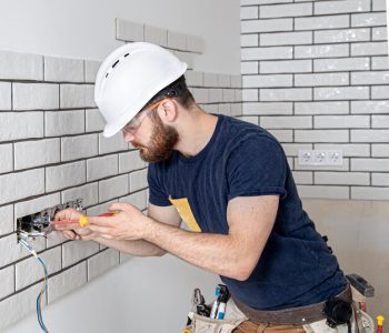 electrician-construction-worker-with-beard-overalls-installation-sockets-home-renovation-concept_169016-7330