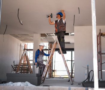 full-shot-man-woman-standing-ladder_23-2149366705