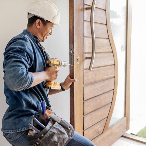 locksmith-man-maintenance-handyman-with-home-renovation-fixing-change-door-locks-with-power-tools-construction-building-industry-trade-with-manual-labour-vocation-emplo