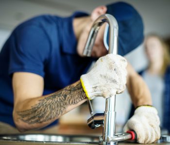 plumber-fixing-kitchen-sink.jpg