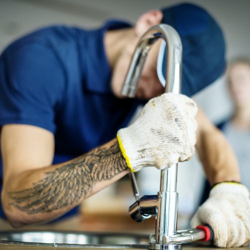 plumber-fixing-kitchen-sink.jpg